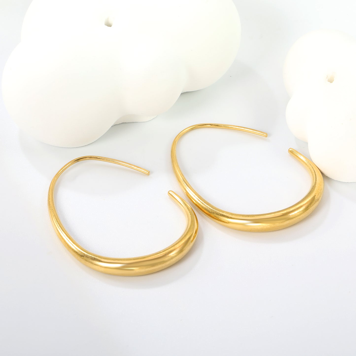 Wholesale luxurious and exquisite gold egg hoop earrings designed specifically for fashion traders.