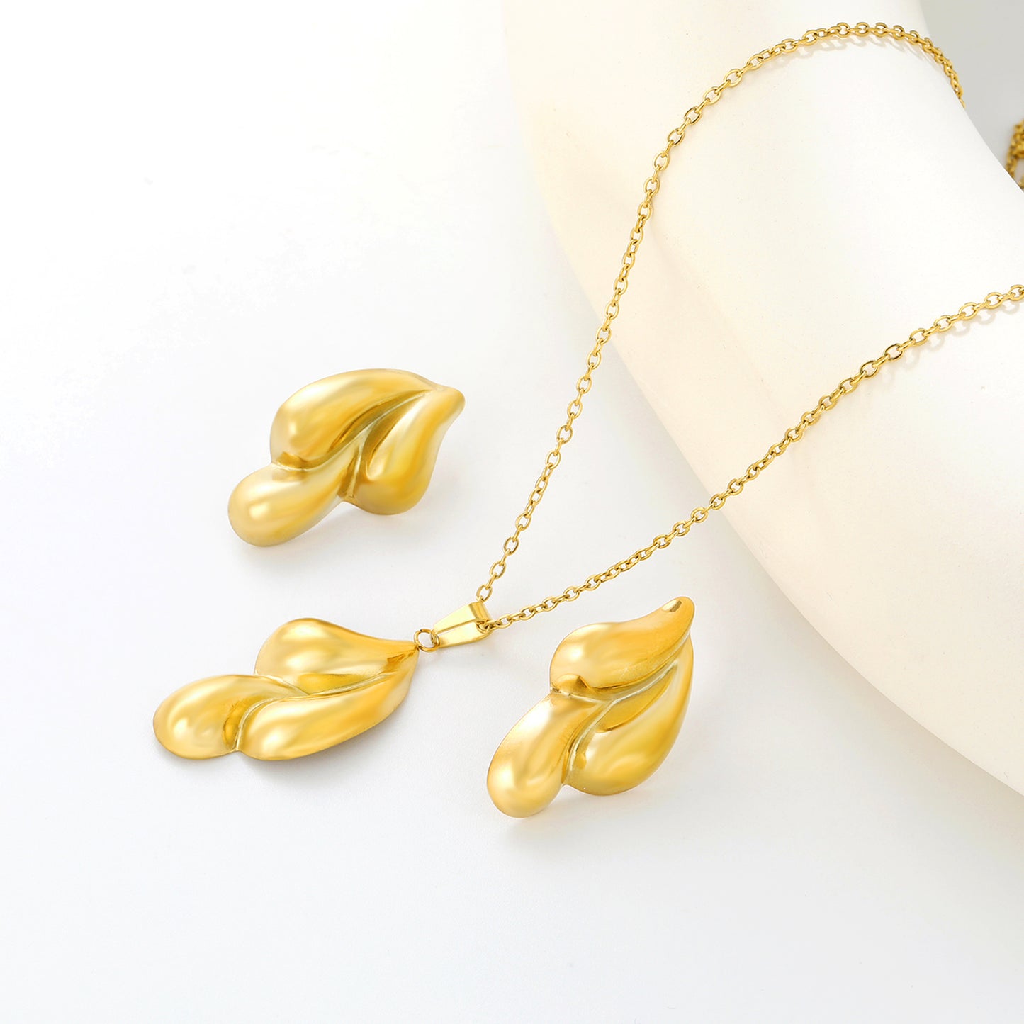 Stainless Steel Gold Hydraulic Embossed Three Drops Set & Cross Chain Round Plaque Jewelry Supplier