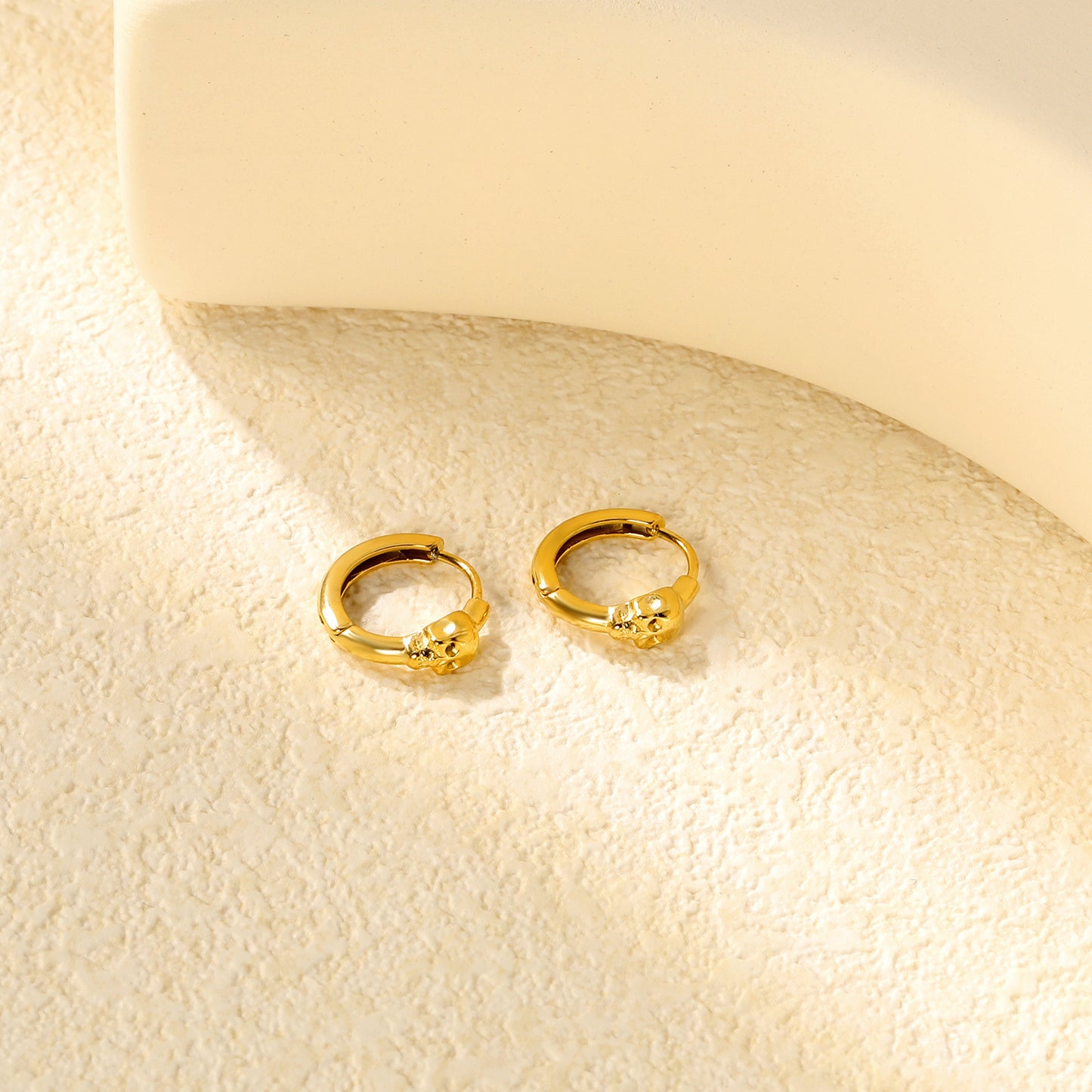 Wholesale Stainless Steel 18K Gold Plated Skull Glossy Stud EarringsClose-ups of the gold plating and details