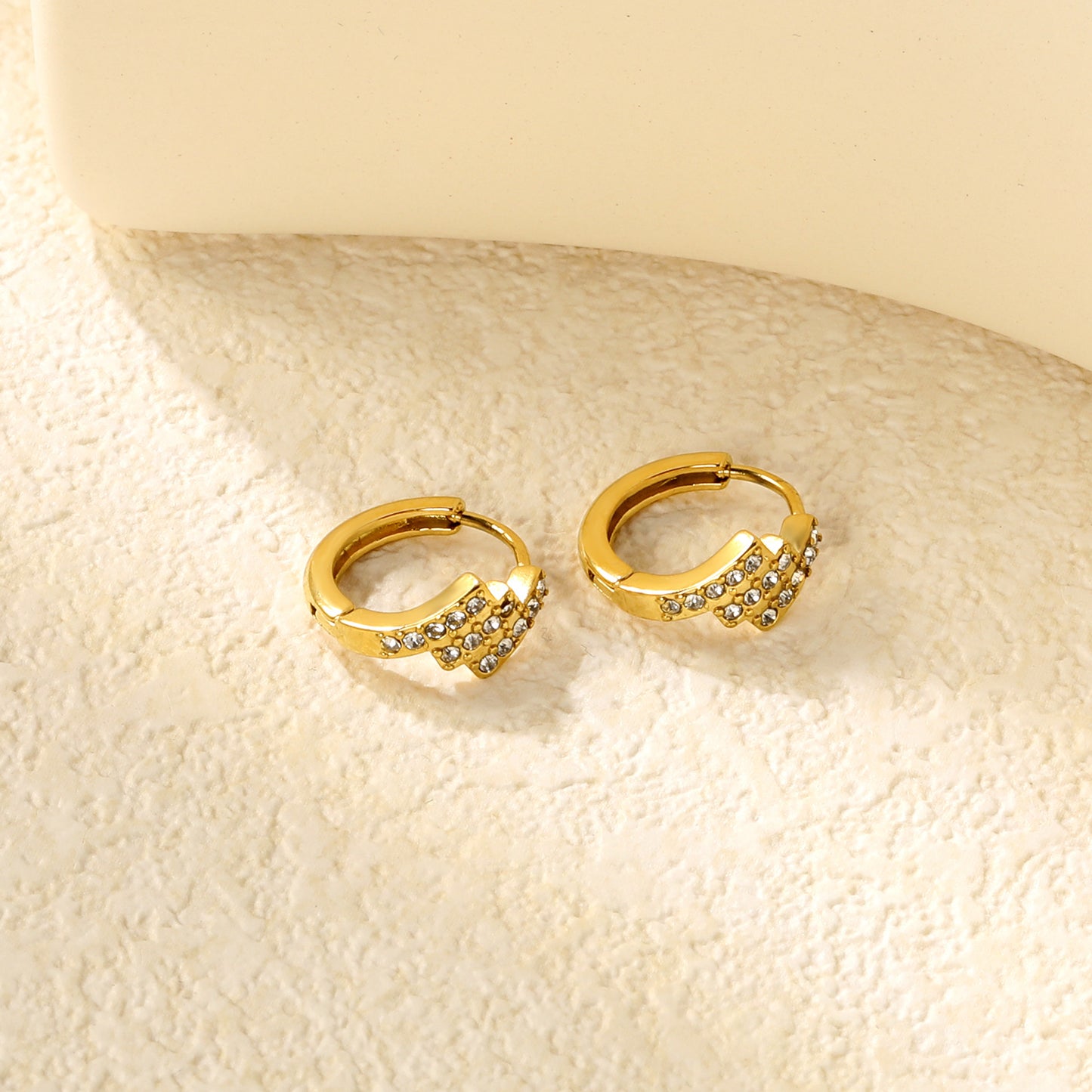 Wholesale Stainless Steel Asymmetrical Rectangle Zircon Hoop EarringsClose-ups of the gold plating and details