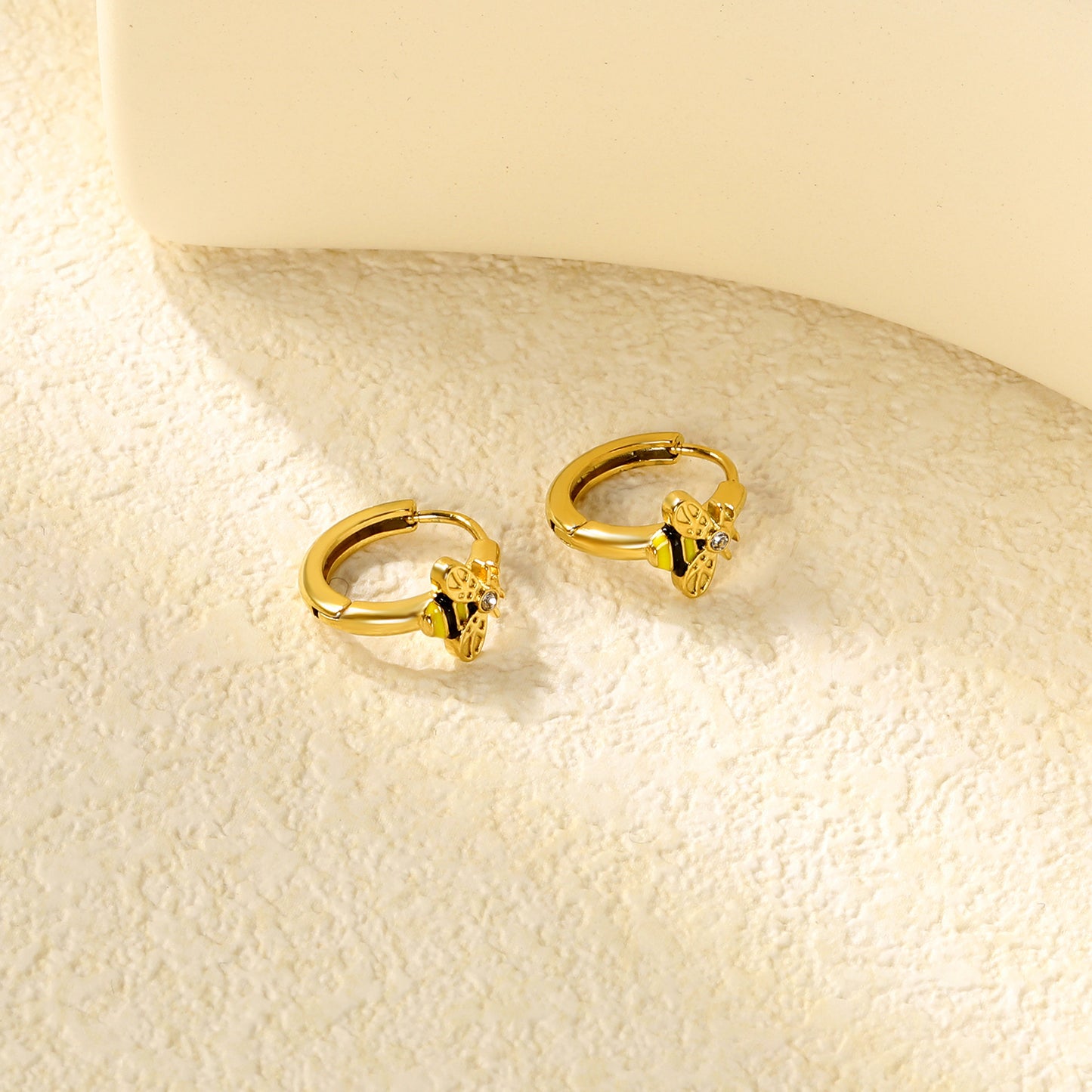 Wholesale Stainless Steel Botanical Bee CZ Hoop EarringsClose-ups of the gold plating and details