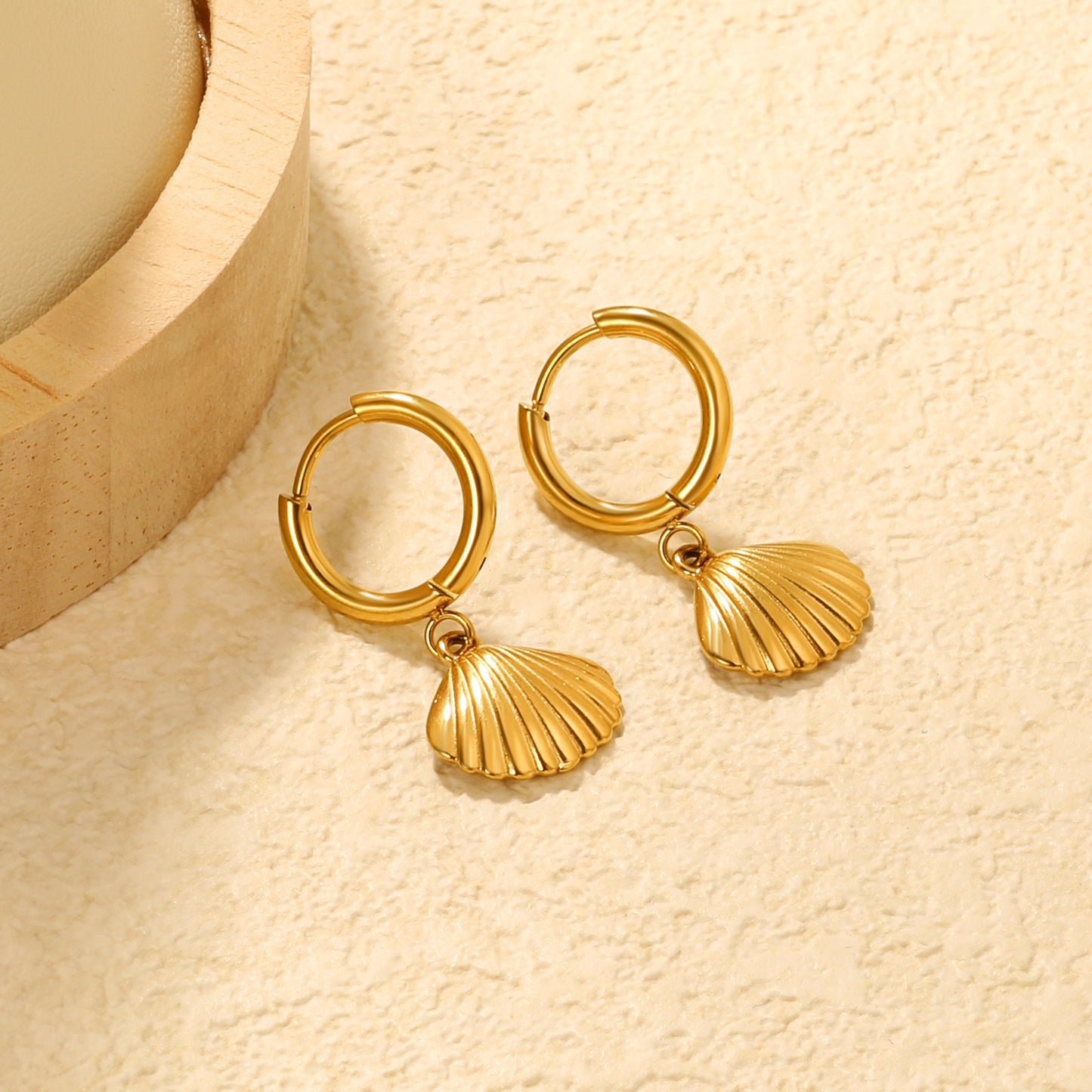 Wholesale Stainless Steel Coastal Shell Charm Hoop EarringsClose-ups of the gold plating and details