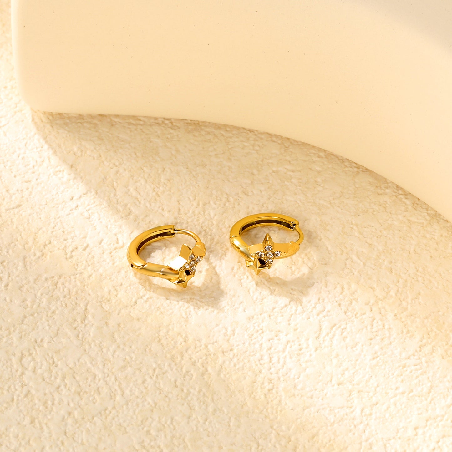 Wholesale Stainless Steel Modern Four-Point Star CZ Hoop EarringsClose-ups of the gold plating and details
