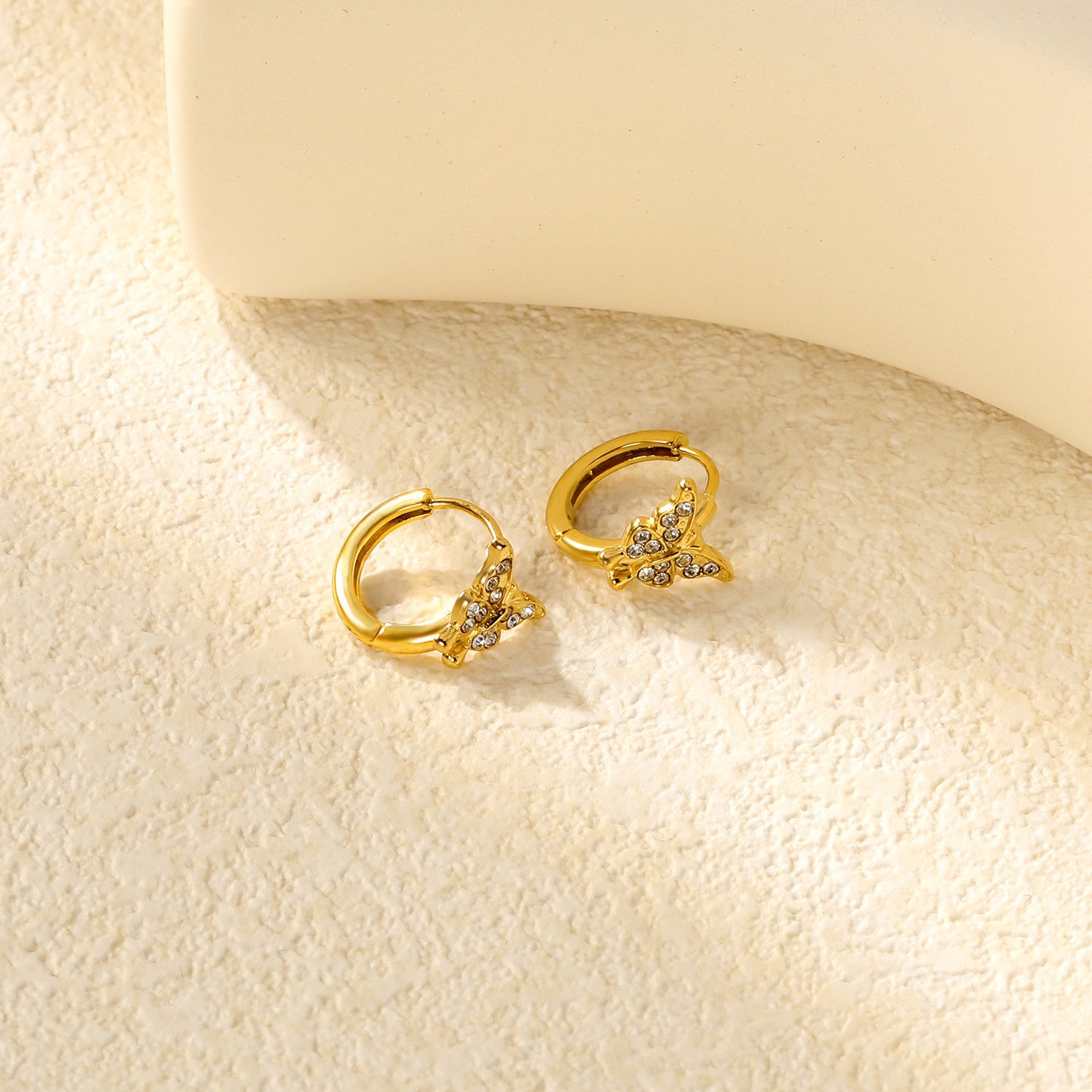 Wholesale Stainless Steel Romantic Butterfly Zircon Hoop EarringsClose-ups of the gold plating and details