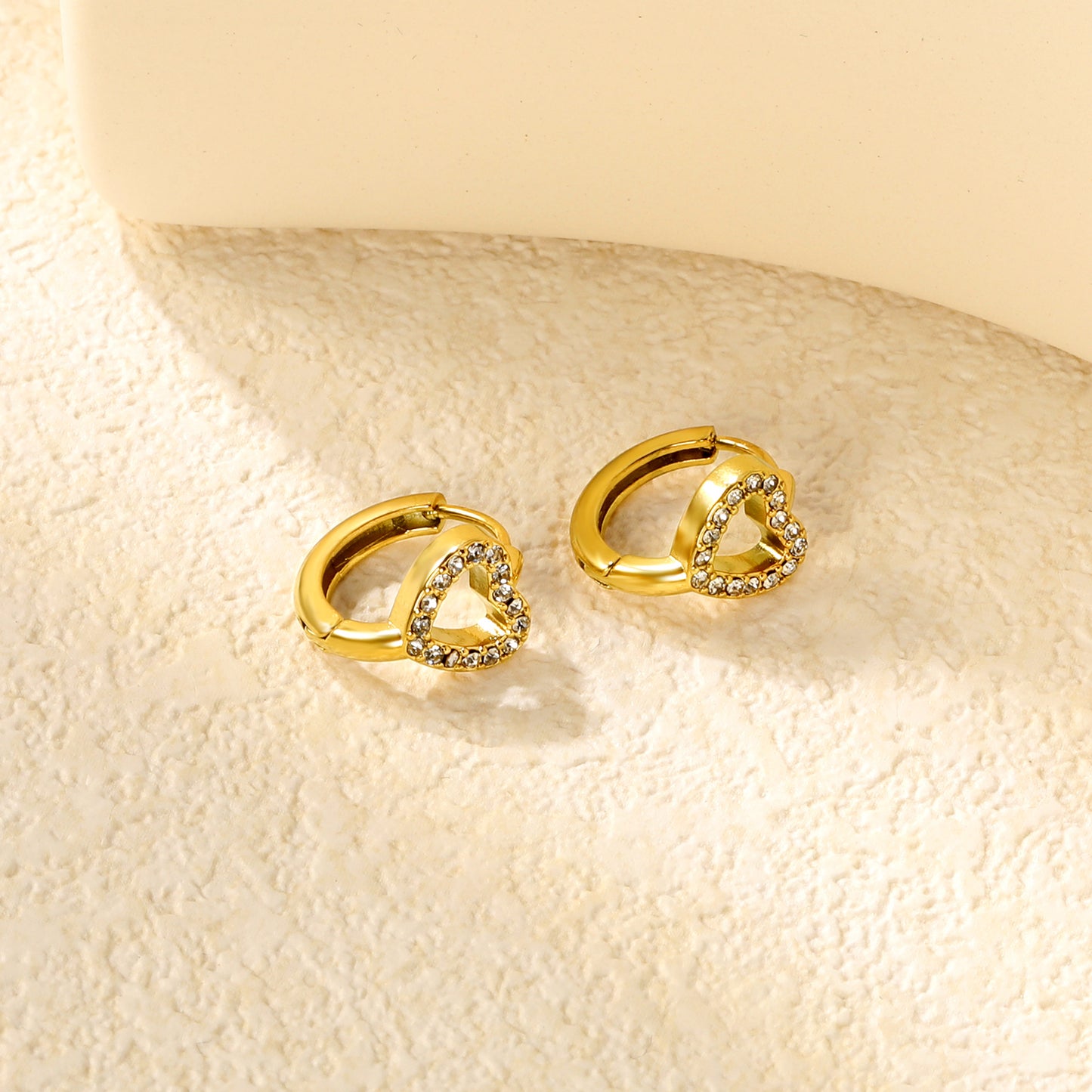 Wholesale Stainless Steel Romantic Hollow Heart Zircon Hoop EarringsClose-ups of the gold plating and details