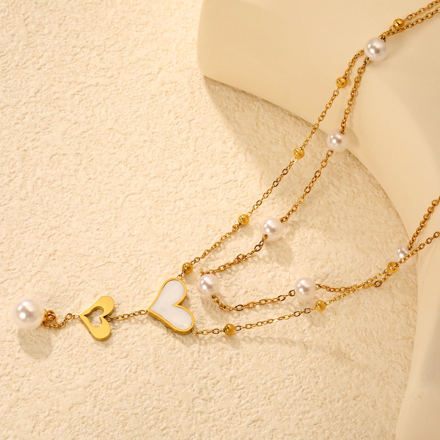 Wholesale Waterproof PVD Gold Sculpted Double Heart Pearl Tassel Necklace