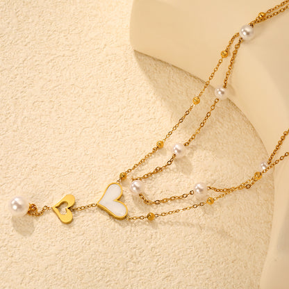 Wholesale Waterproof PVD Gold Sculpted Double Heart Pearl Tassel Necklace