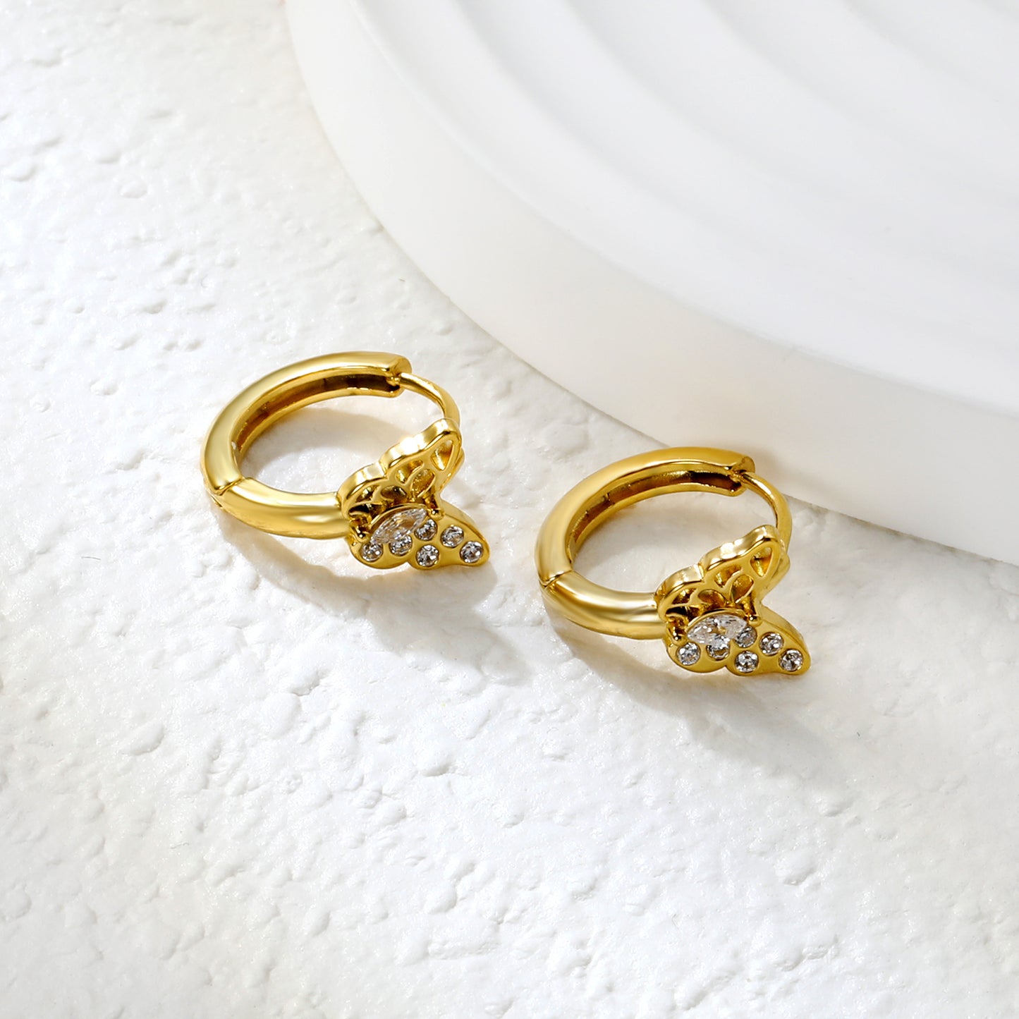 Bulk 18K Gold Plated Airy Hollow Butterfly Zircon Hoop EarringsClose-up of the light-colored ambiance