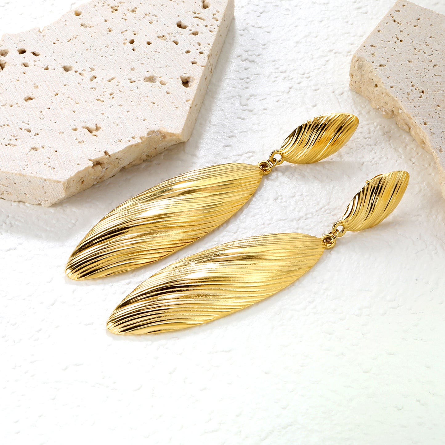 Bulk 18K Gold Plated Botanical Leaf Texture Drop StudsClose-up of the light-colored ambiance
