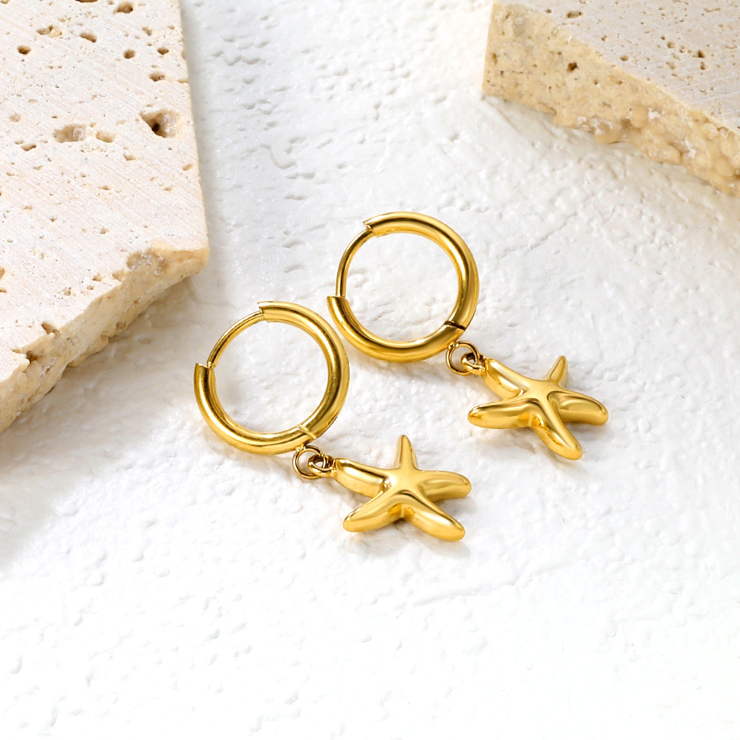Bulk 18K Gold Plated Botanical Starfish Charm Hoop EarringsClose-up of the light-colored ambiance
