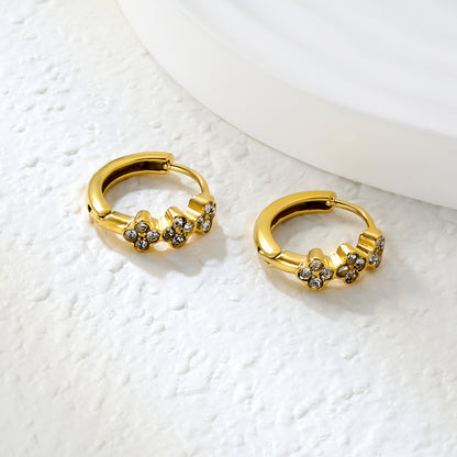 Bulk 18K Gold Plated Botanical Triple Flower CZ Hoop EarringsClose-up of the light-colored ambiance