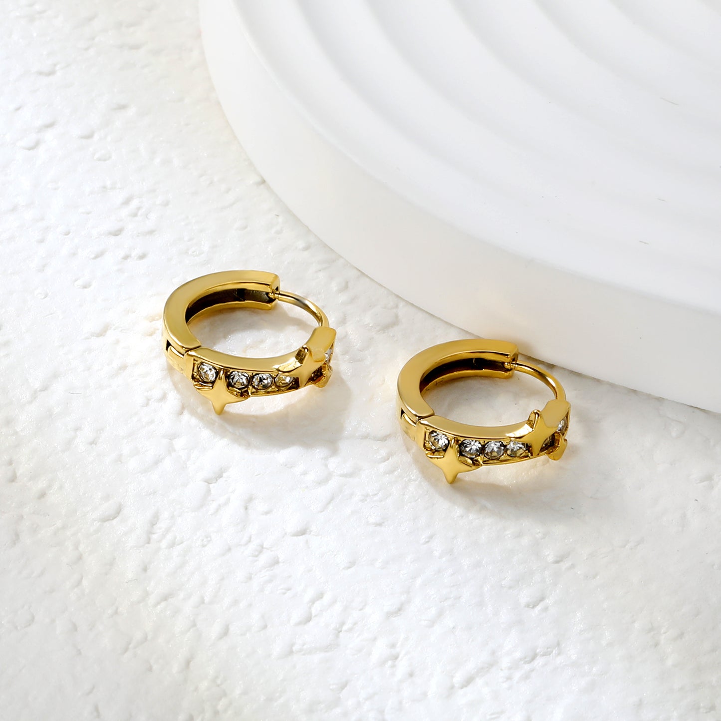 Bulk 18K Gold Plated Celestial Star Half-Circle CZ Hoop EarringsClose-up of the light-colored ambiance