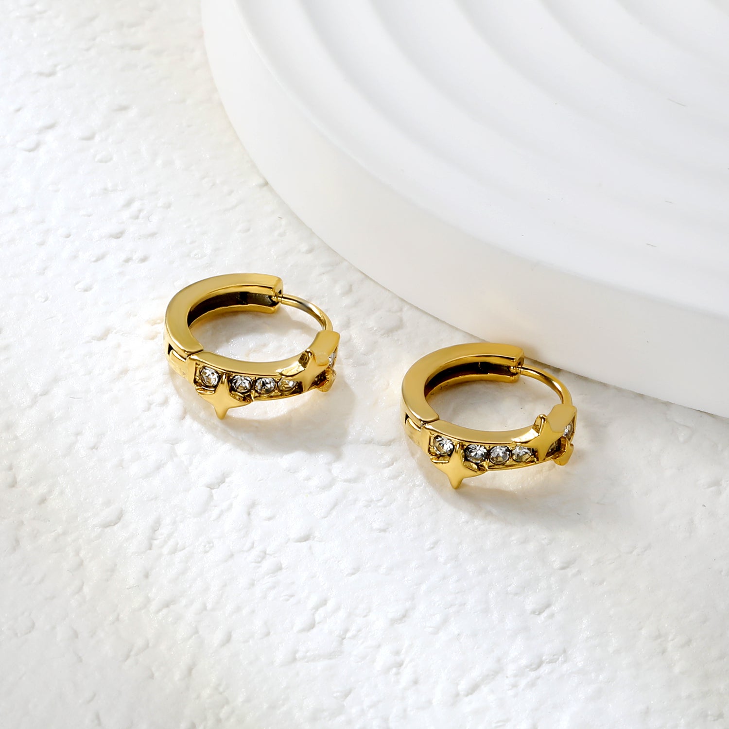 Bulk 18K Gold Plated Celestial Star Half-Circle CZ Hoop EarringsClose-up of the light-colored ambiance