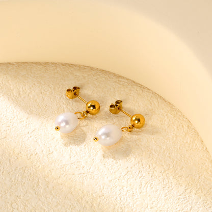 Bulk 18K Gold Plated Classic Pearl & Bead Drop StudsClose-up of the light-colored ambiance