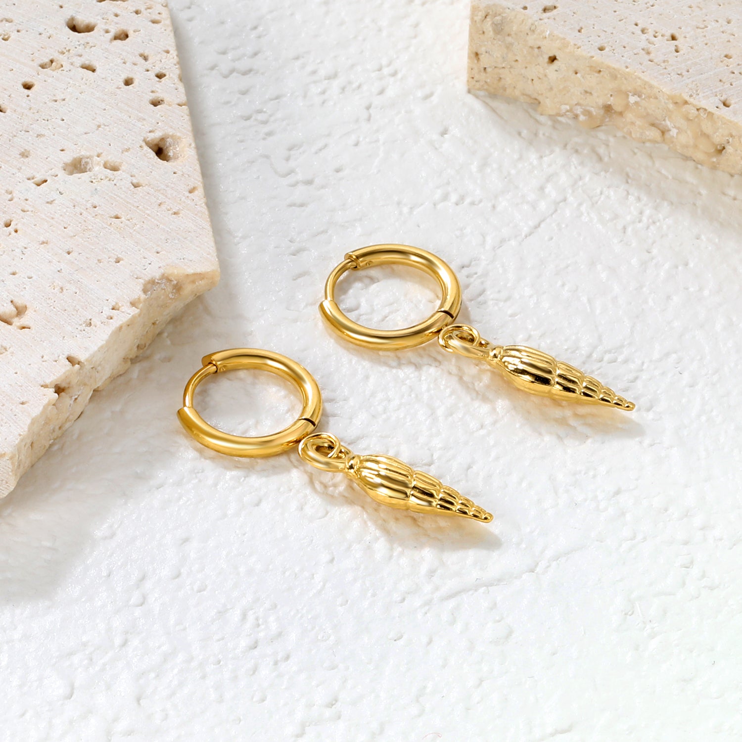 Bulk 18K Gold Plated Coastal Conch Shell Charm Hoop EarringsClose-up of the light-colored ambiance
