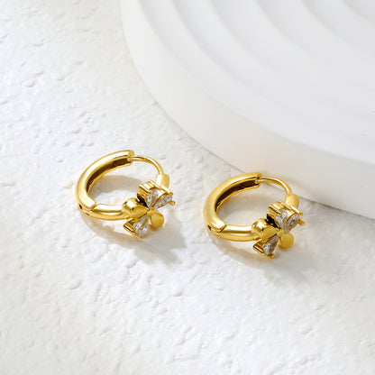 Bulk 18K Gold Plated Delicate Triple Stone Flower Hoop EarringsClose-up of the light-colored ambiance