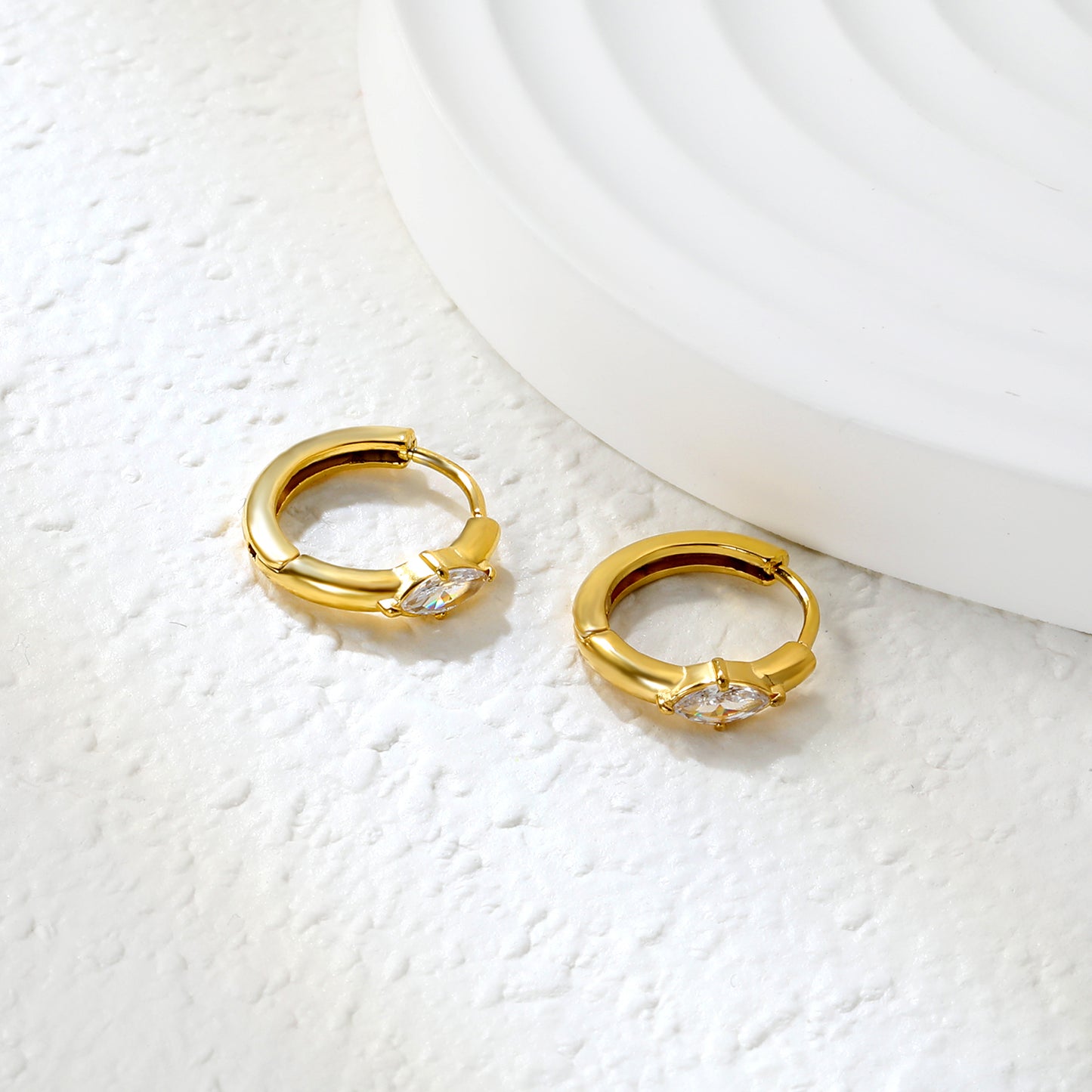 Bulk 18K Gold Plated Luxe Diamond Zircon Hoop EarringsClose-up of the light-colored ambiance