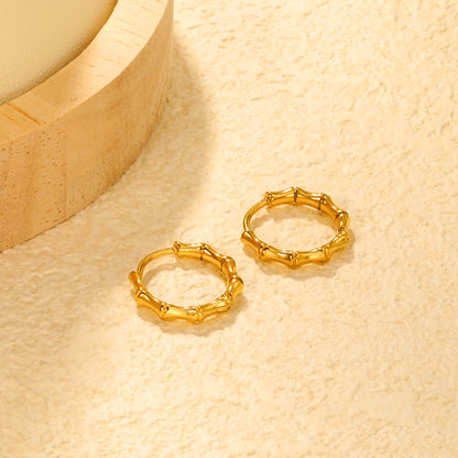 Bulk 18K Gold Plated Sleek Polished Bamboo EarringsClose-up of the light-colored ambiance
