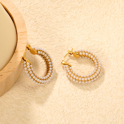 Bulk Buy 18K Gold Plated Pearl Hoop Earrings Double Row Waterproof DesignClose-up of the light-colored ambiance