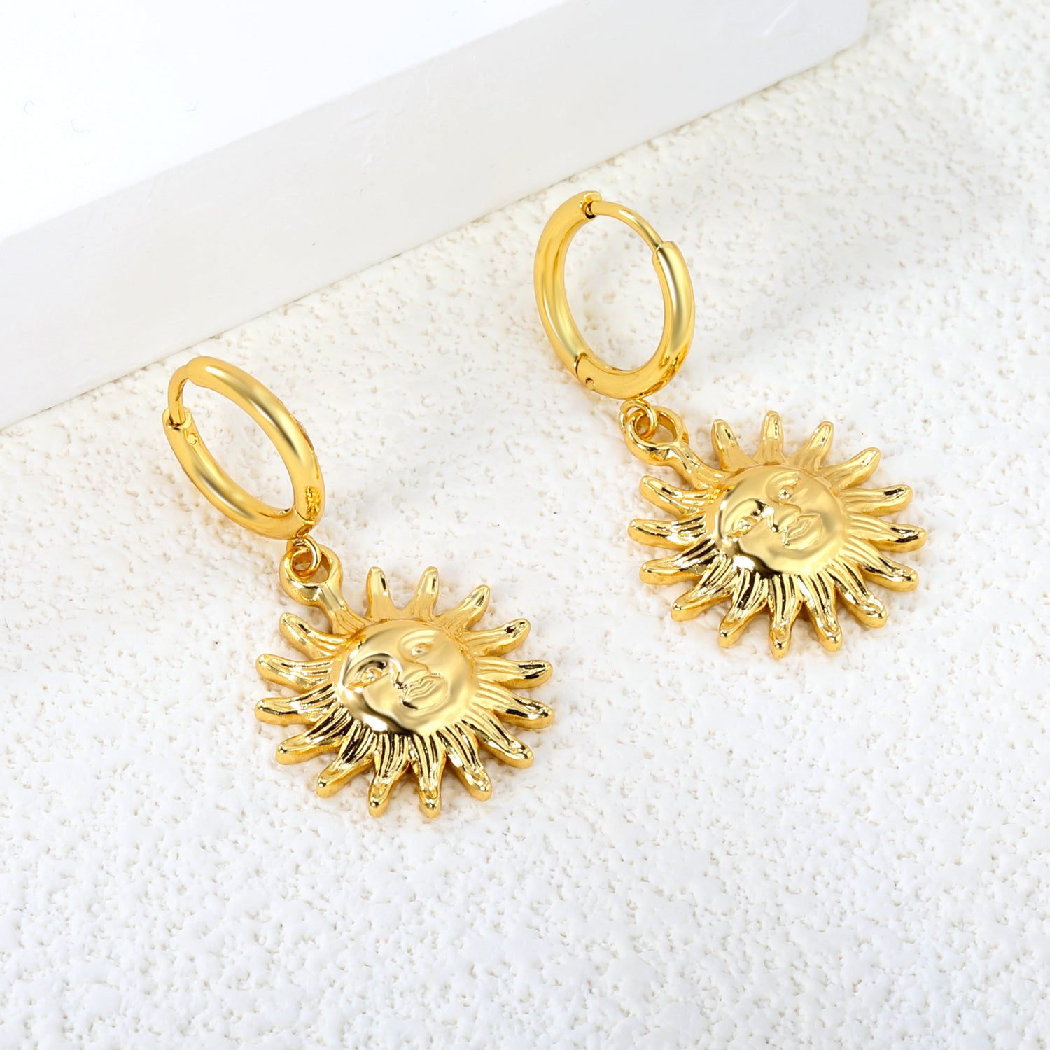 Gold earrings + sun pendant earrings jewelry supplierHigh-resolution Lifestyle Photos