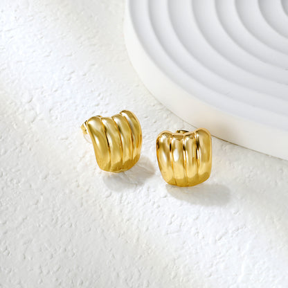 Golden banana oil drop earrings jewelry suppliers Close-up of the light-colored ambiance