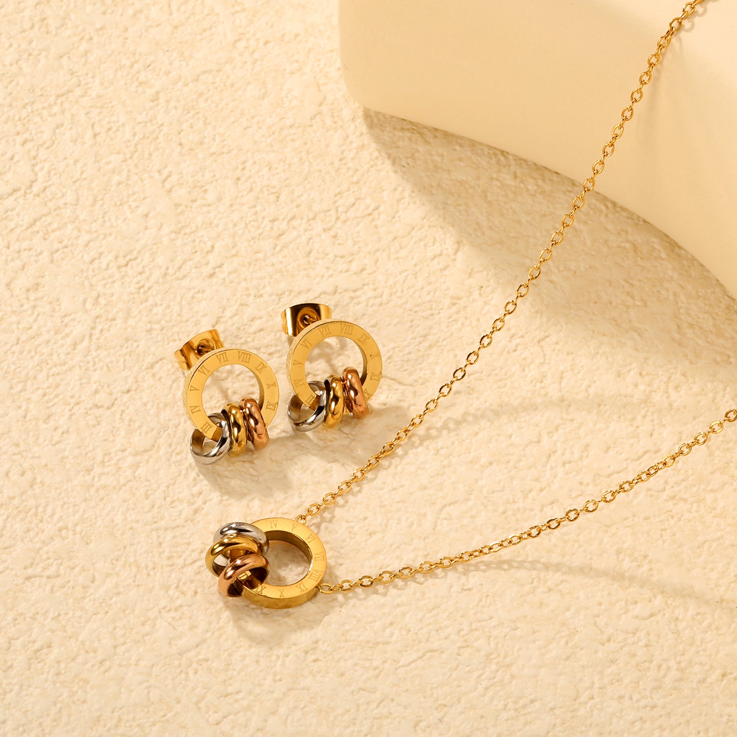 Wholesale Waterproof PVD Roman Numeral Hollow Three-Color Jewelry Set