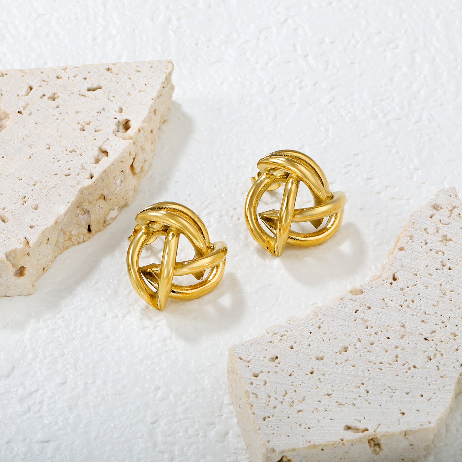 Wholesale 18K Gold Plated Knot Earrings Textured Weave Industrial VintageClose-up of the light-colored ambiance