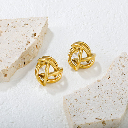 Wholesale 18K Gold Plated Knot Earrings Textured Weave Industrial VintageClose-up of the light-colored ambiance
