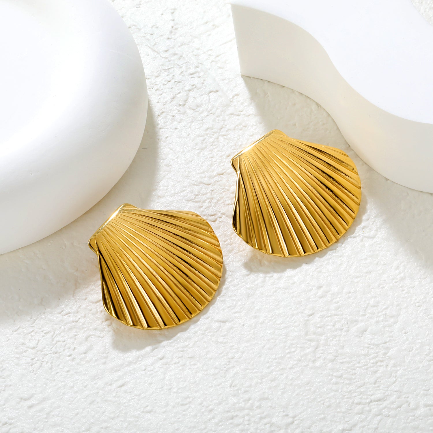 Wholesale 18K Gold Plated Shell Earrings Textured Surface Natural Theme LuxuryClose-up of the light-colored ambiance
