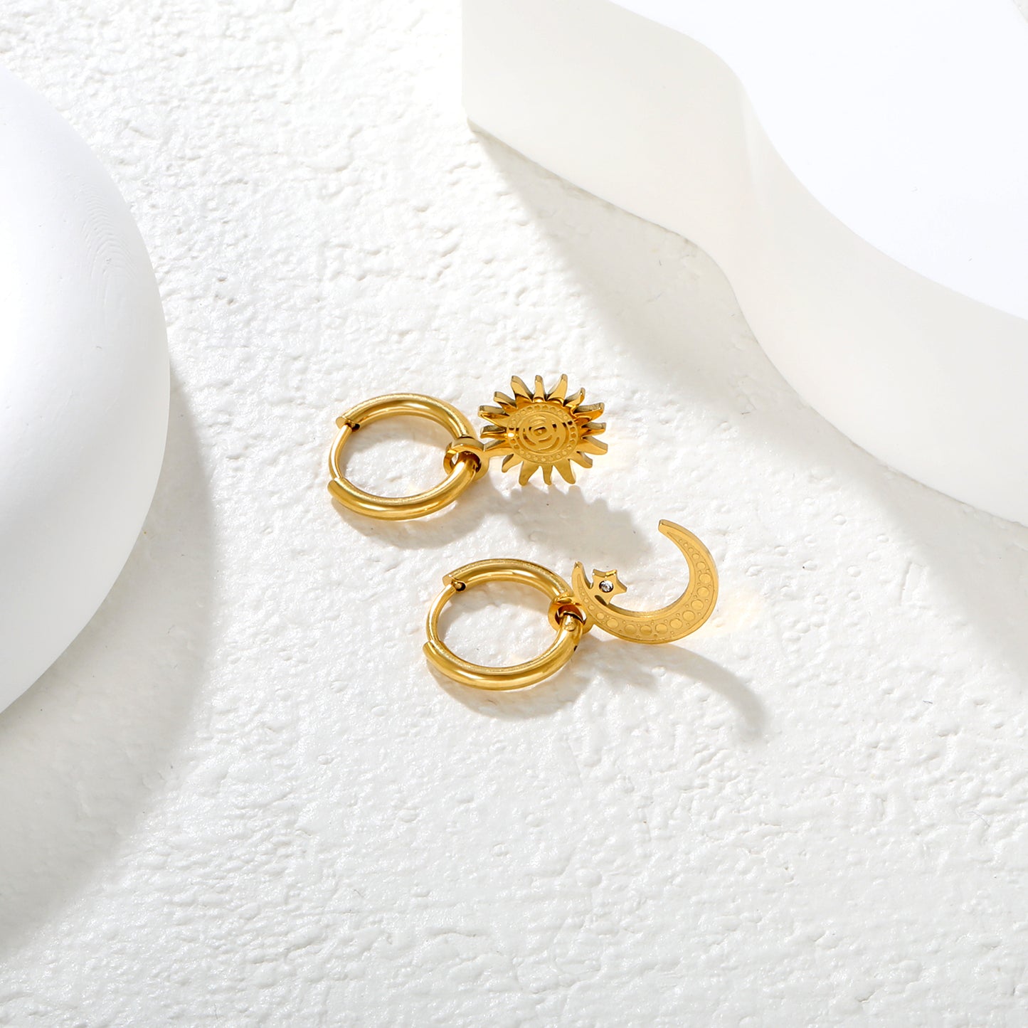 Wholesale 18K Gold Plated Sun and Moon Drop Earrings Celestial Theme Natural LuxuryClose-up of the light-colored ambiance