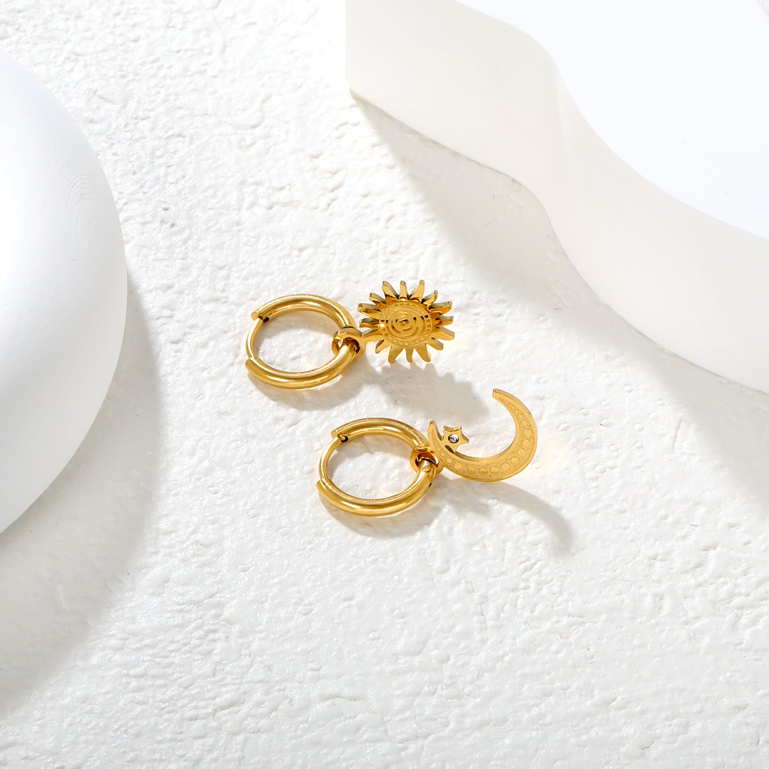 Wholesale 18K Gold Plated Sun and Moon Drop Earrings Celestial Theme Natural LuxuryClose-up of the light-colored ambiance