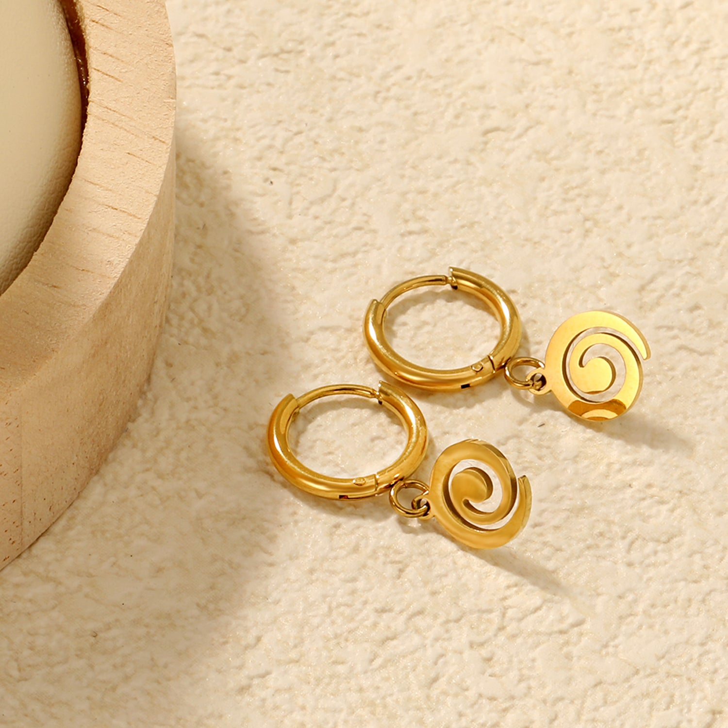 Wholesale 18K gold-plated spiral disc hoop earrings, vintage-inspired, minimalist styleClose-ups of the gold plating and details
