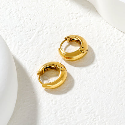 Wholesale Chunky Dome Hoop Earrings PVD Gold Two-Tone Minimalist WaterproofClose-up of the light-colored ambiance