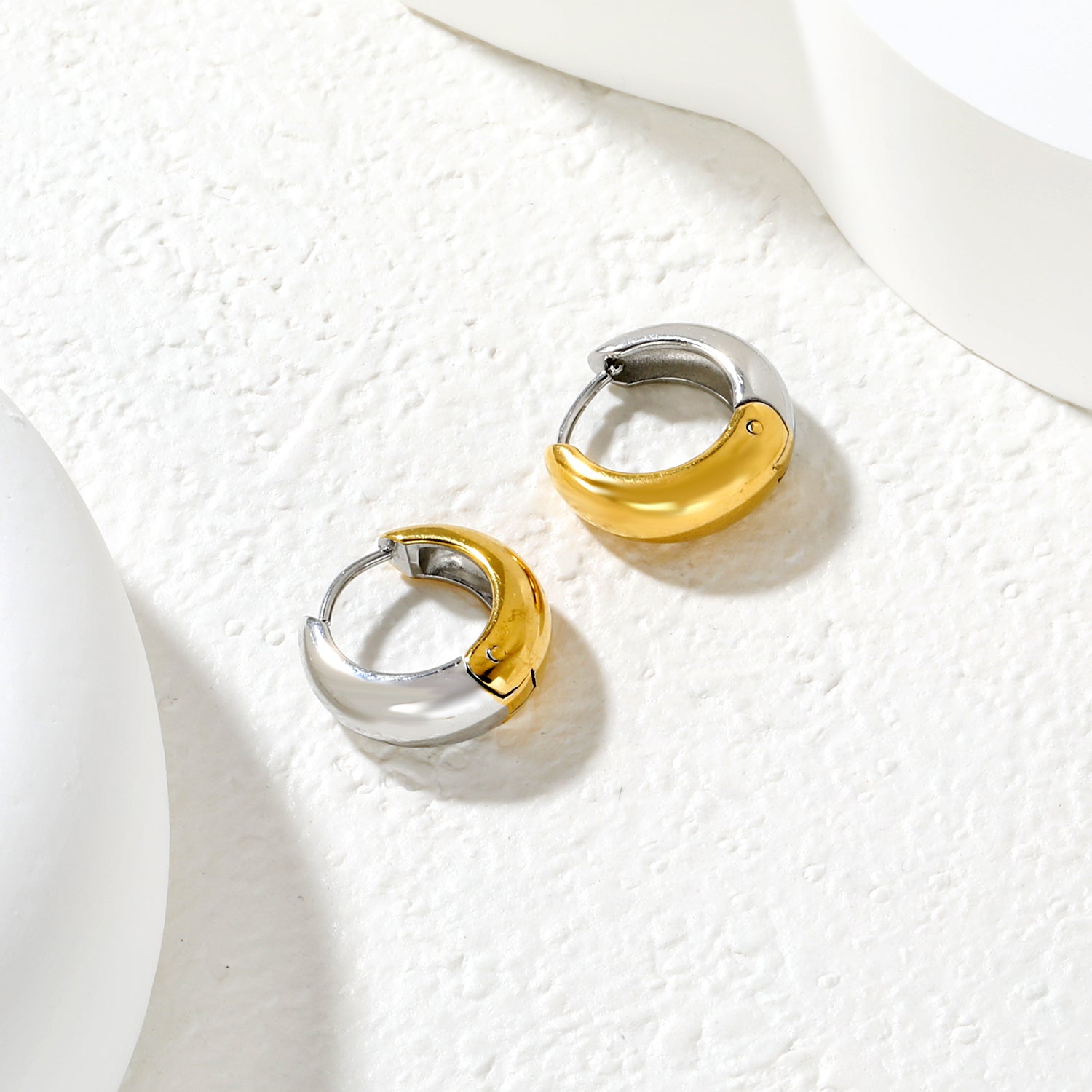 Wholesale Chunky Dome Hoop Earrings PVD Gold Two-Tone Minimalist WaterproofClose-up of the light-colored ambiance_mixed