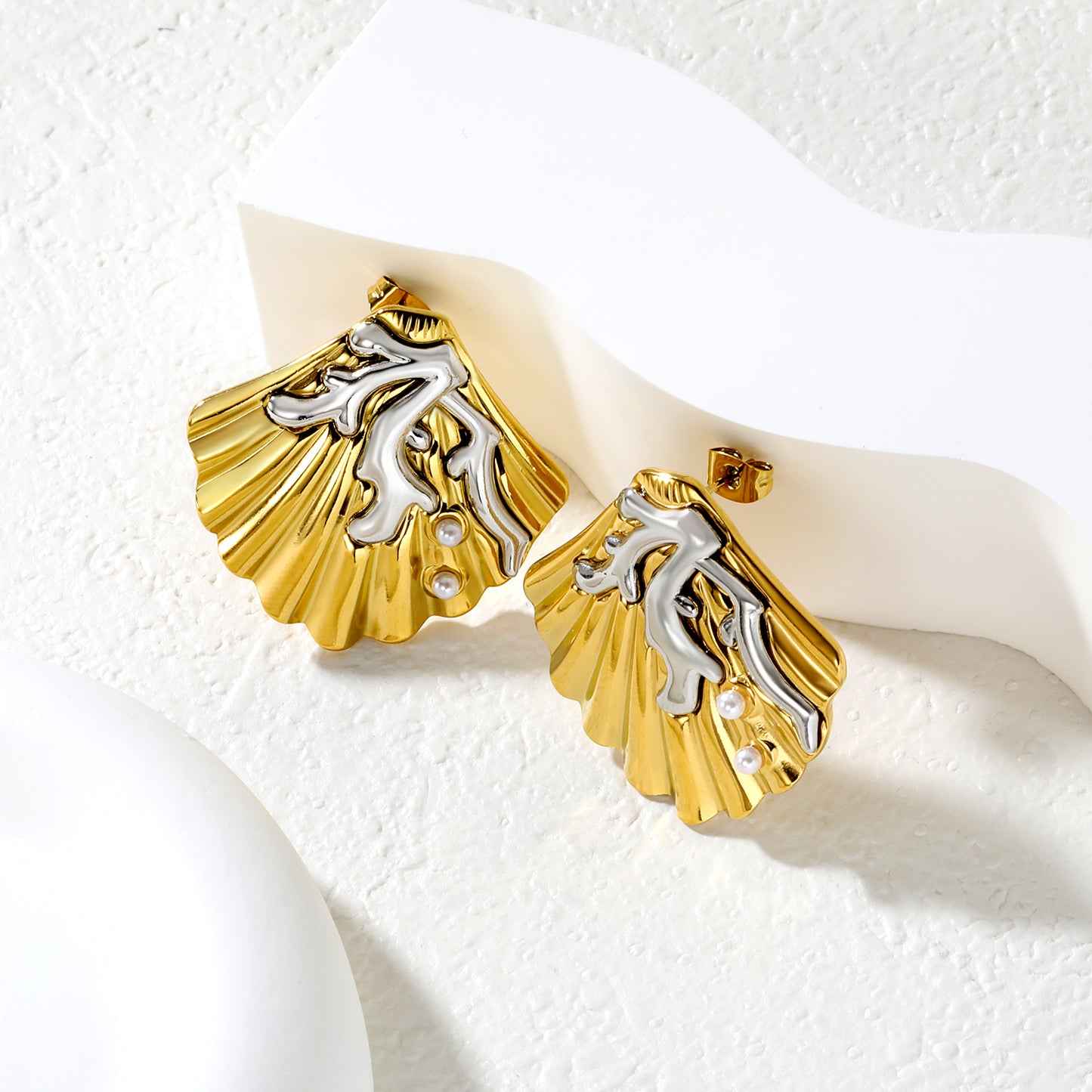 Wholesale Engraved Shell Earrings 18K Gold with Pearl - Jacey JewelryClose-up of the light-colored ambiance