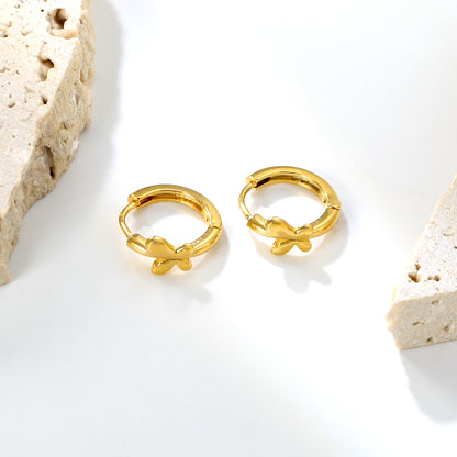 Wholesale Stainless Steel 18K Gold Plated 18K Gold Plated Glossy Butterfly EarringsClose-up of the light-colored ambiance