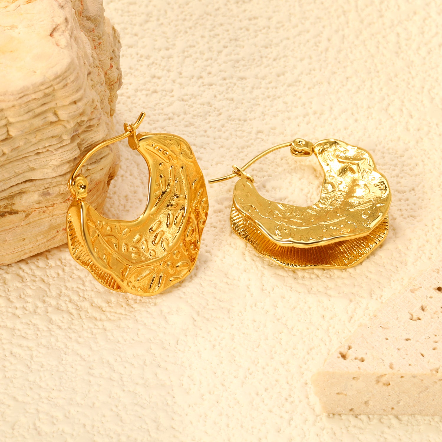 Wholesale Stainless Steel 18K Gold Plated Cast Maple Leaf Stud EarringsClose-up of the light-colored ambiance