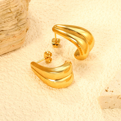 Wholesale Stainless Steel 18K Gold Plated Glossy Double Wire Hook Stud EarringsClose-up of the light-colored ambiance