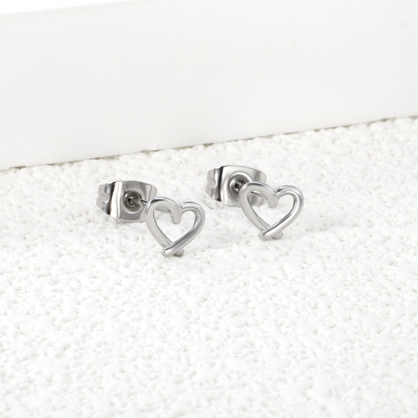 Wholesale Stainless Steel 18K Gold Plated Heart Shape Openwork Plain Pin EarringsHigh-resolution Lifestyle Photos_silver