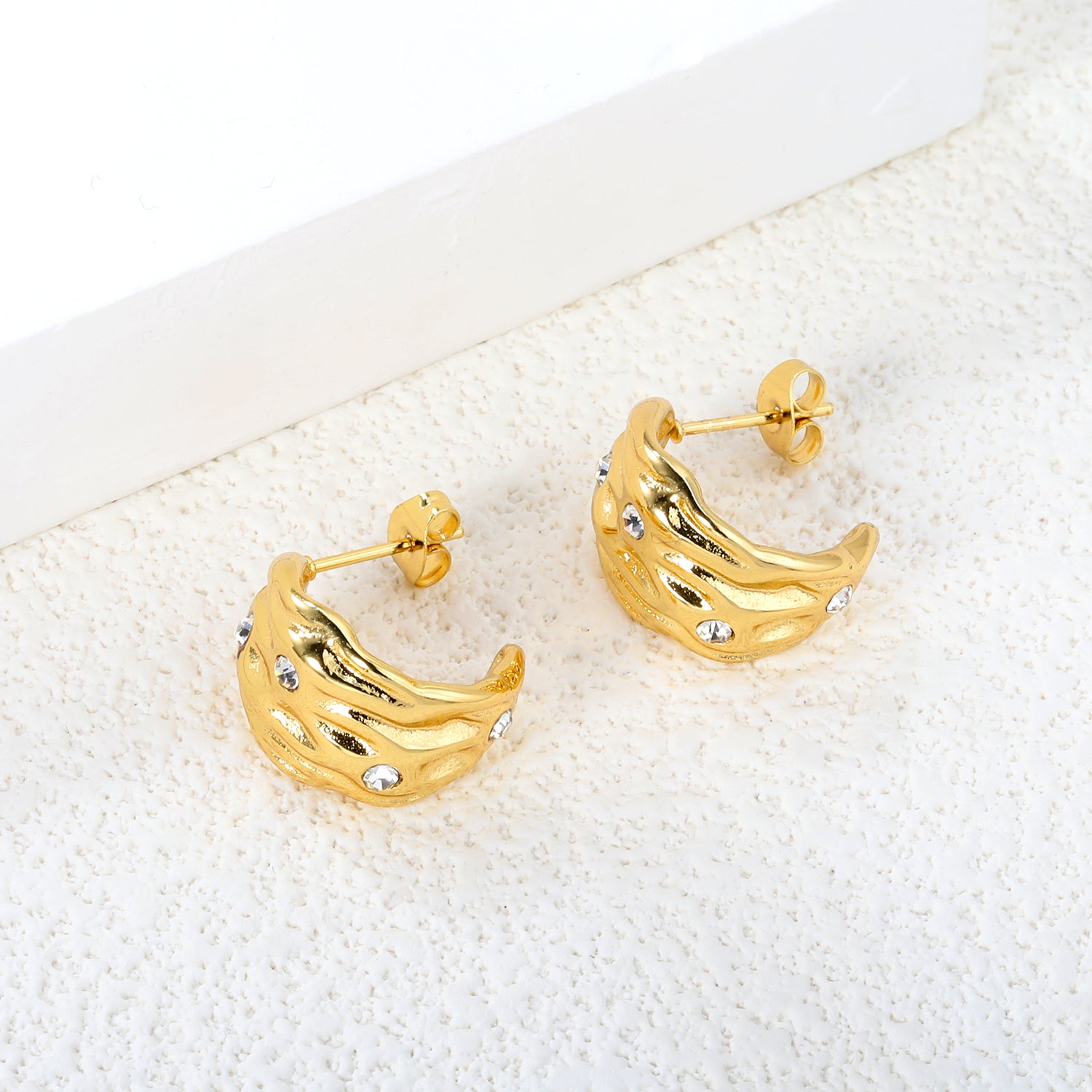 Wholesale Stainless Steel 18K Gold Plated Irregular Pattern C Shape Open Stud Earrings with Sticky White DiamondsClose-ups of the gold plating and details