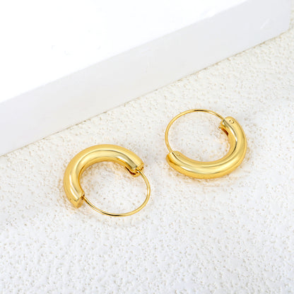 Wholesale Stainless Steel 18K Gold Plated Semi-circular Pendant Stud EarringsClose-up of the light-colored ambiance