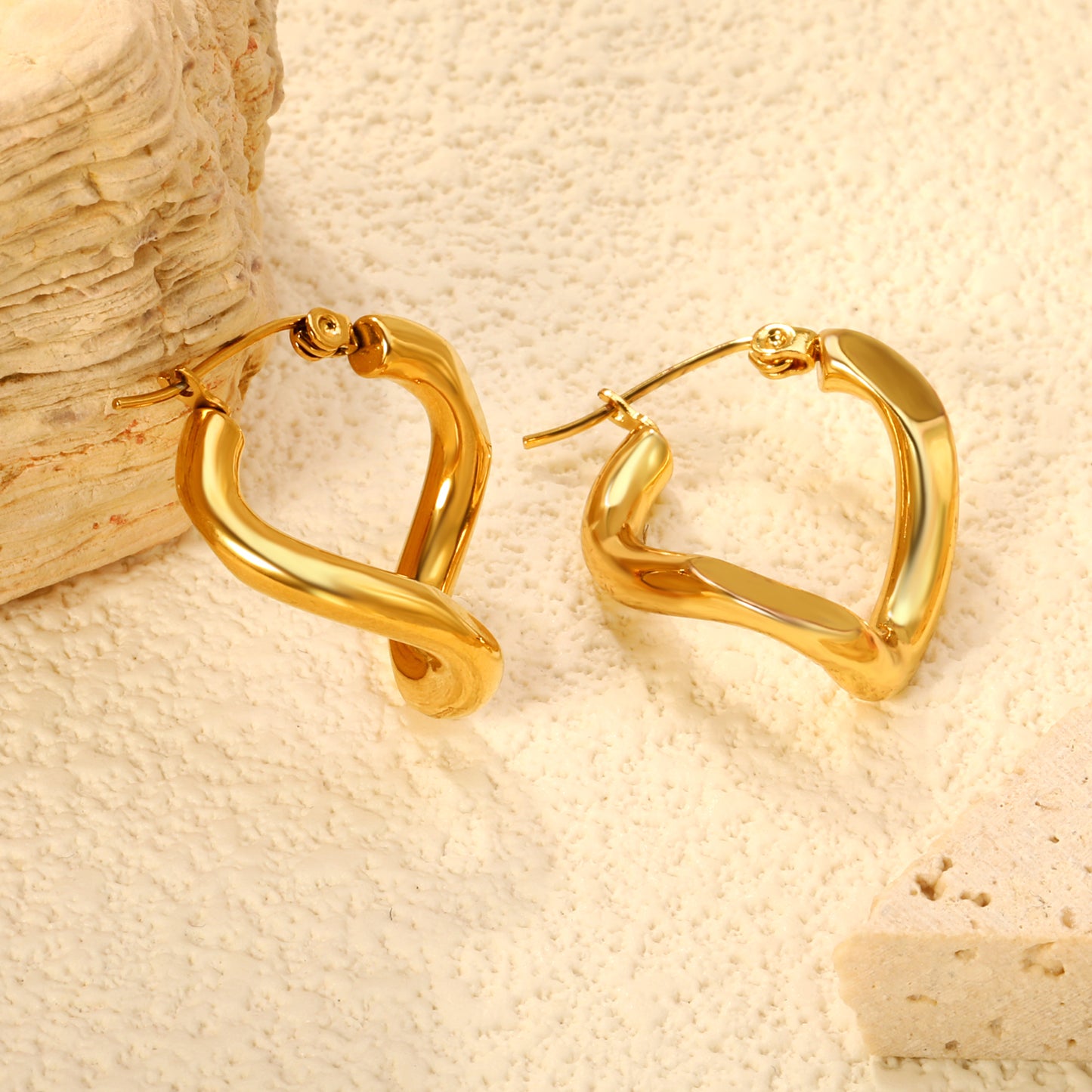 Wholesale Stainless Steel 18K Gold Plated Twisted Thread Reversible Angle Stud EarringsClose-up of the light-colored ambiance