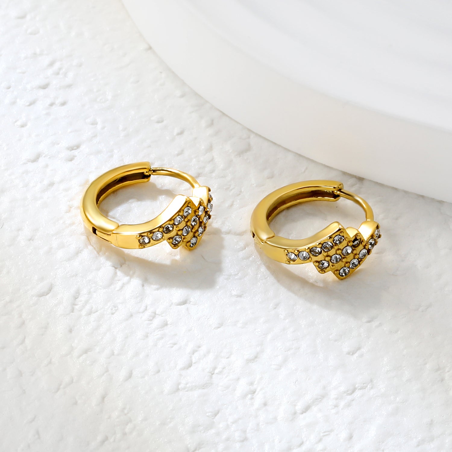 Wholesale Stainless Steel Asymmetrical Rectangle Zircon Hoop EarringsClose-up of the light-colored ambiance