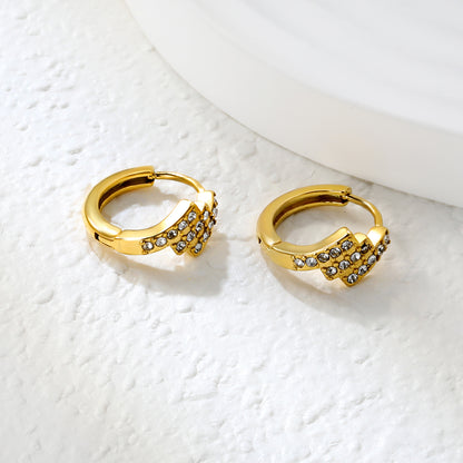 Wholesale Stainless Steel Asymmetrical Rectangle Zircon Hoop EarringsClose-up of the light-colored ambiance
