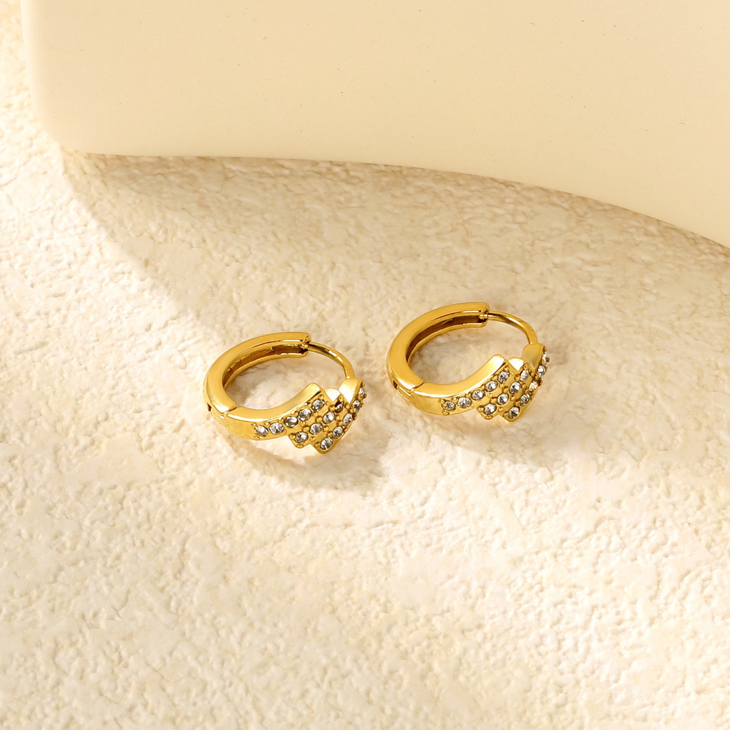 Wholesale Stainless Steel Asymmetrical Rectangle Zircon Hoop EarringsClose-ups of the gold plating and details
