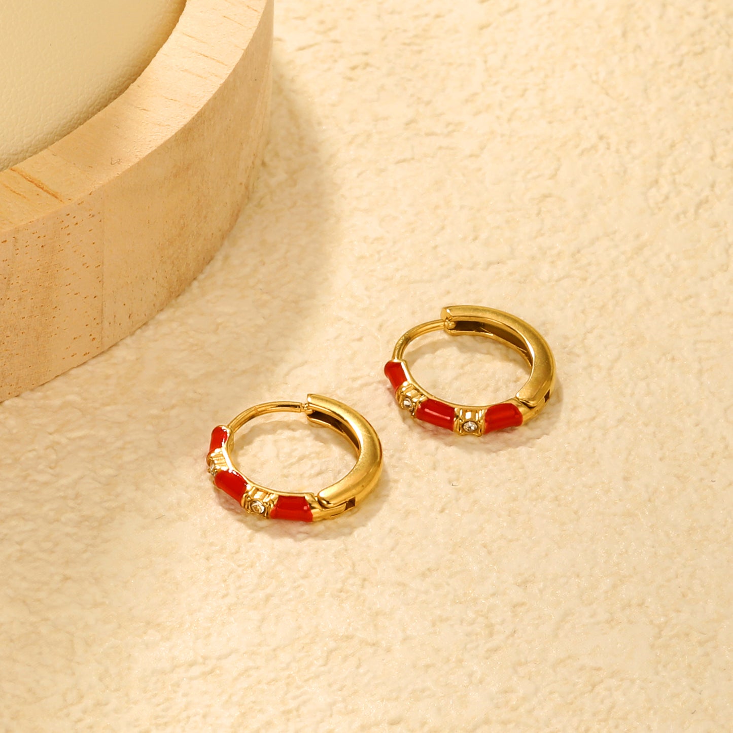 Wholesale Stainless Steel Bold Red Enamel & Diamond EarringsClose-up of the light-colored ambiance