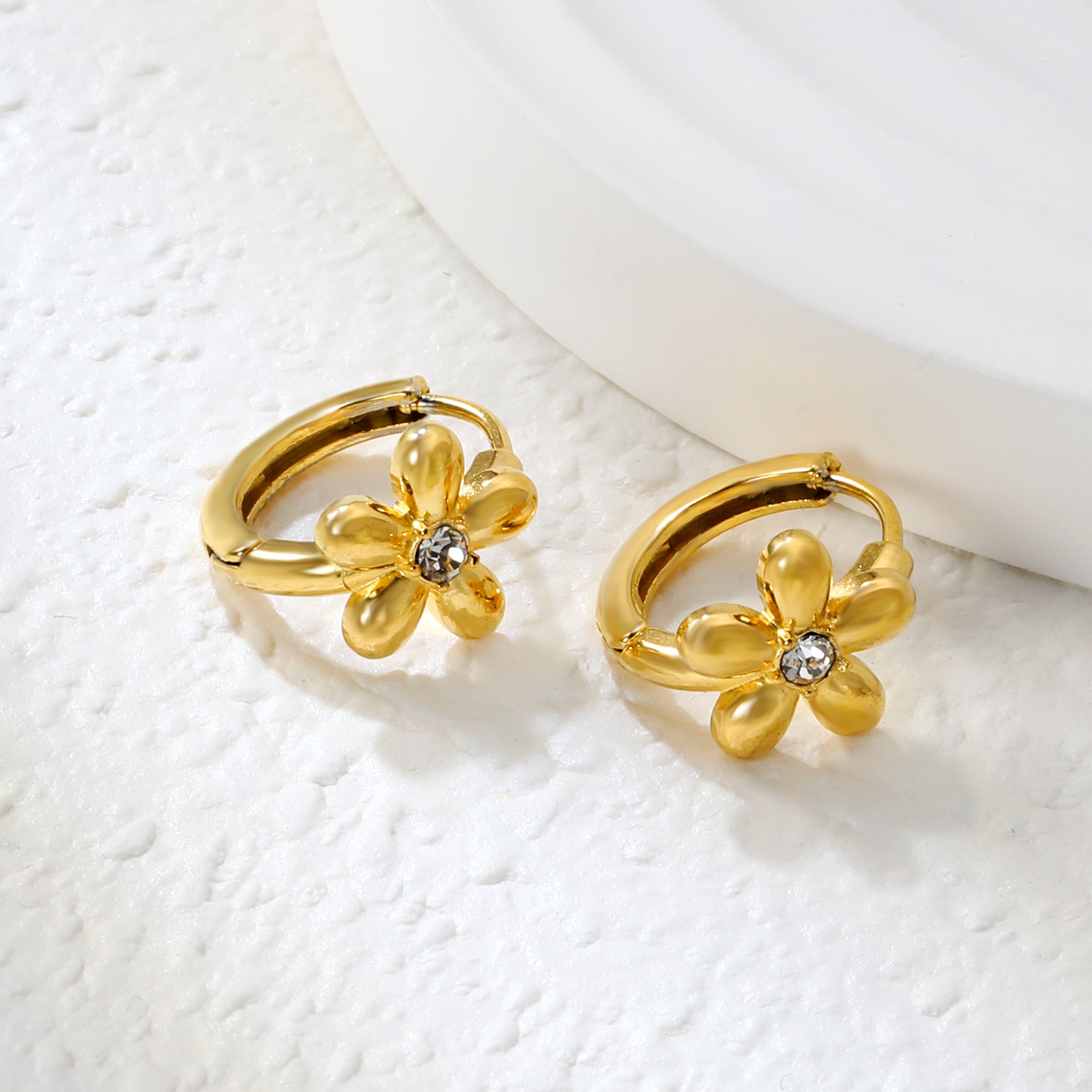 Wholesale Stainless Steel Botanical Flower Zircon Hoop EarringsClose-up of the light-colored ambiance