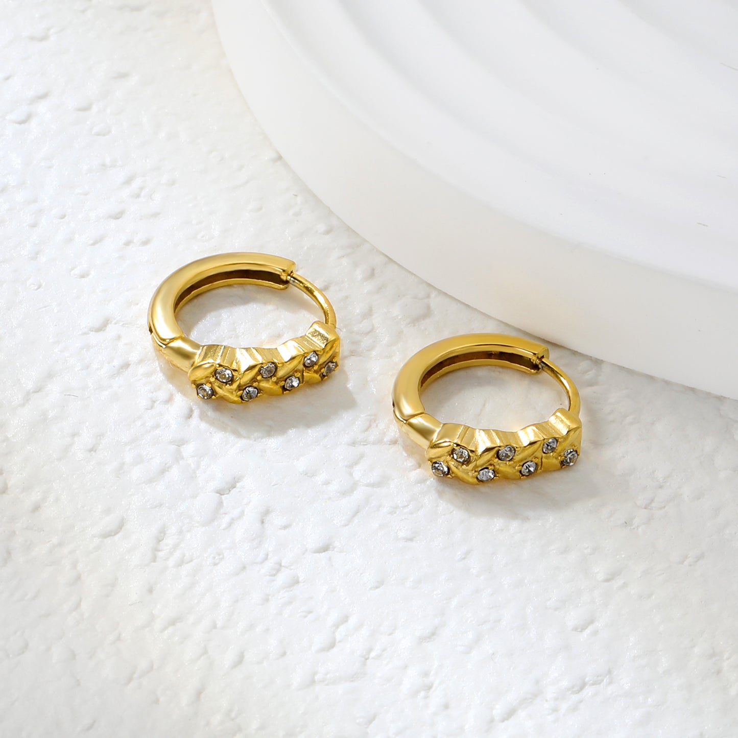 Wholesale Stainless Steel Botanical Grass Wreath Crystal Hoop EarringsClose-up of the light-colored ambiance