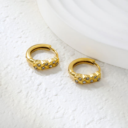Wholesale Stainless Steel Botanical Grass Wreath Crystal Hoop EarringsClose-up of the light-colored ambiance