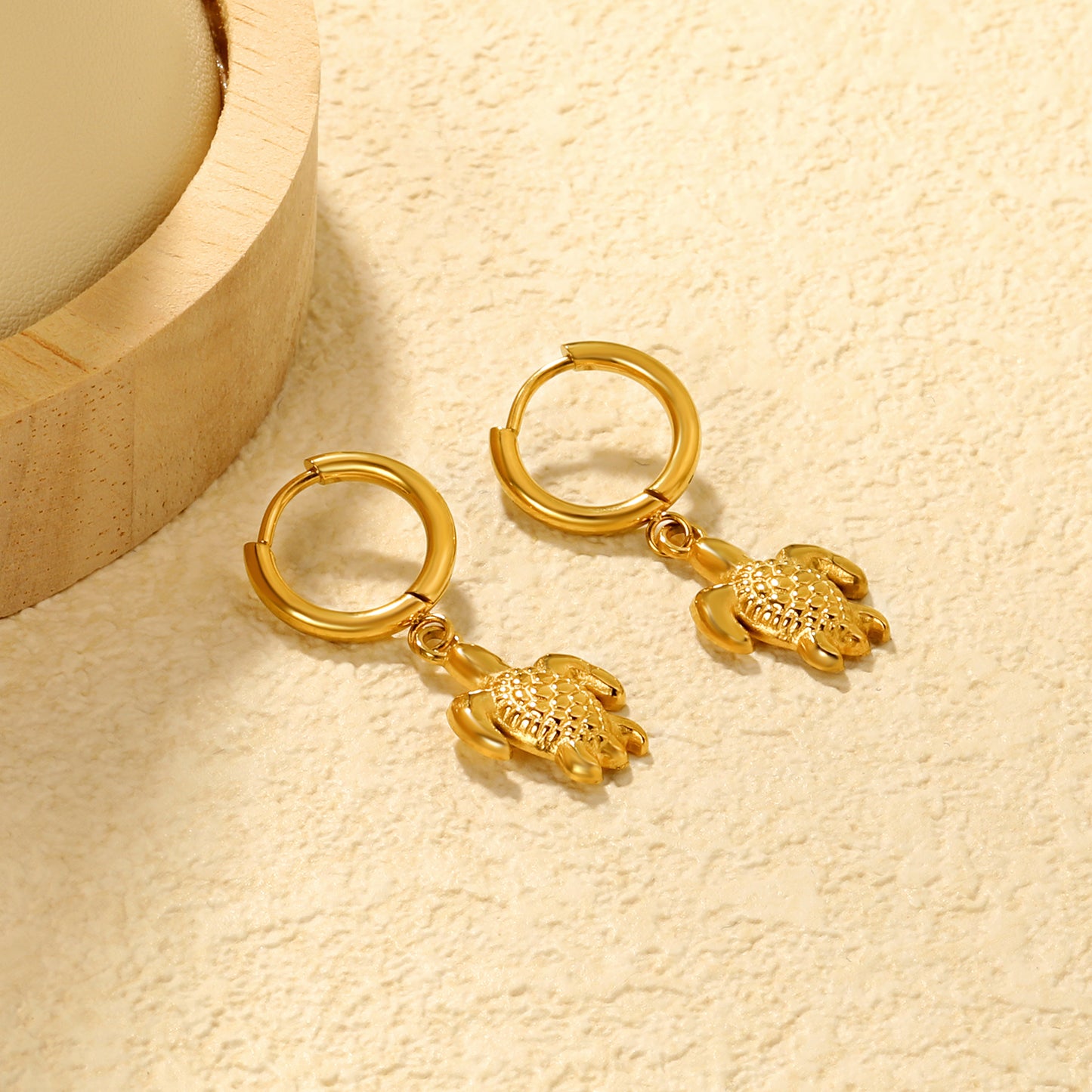 Wholesale Stainless Steel Botanical Turtle Charm Hoop EarringsClose-ups of the gold plating and details